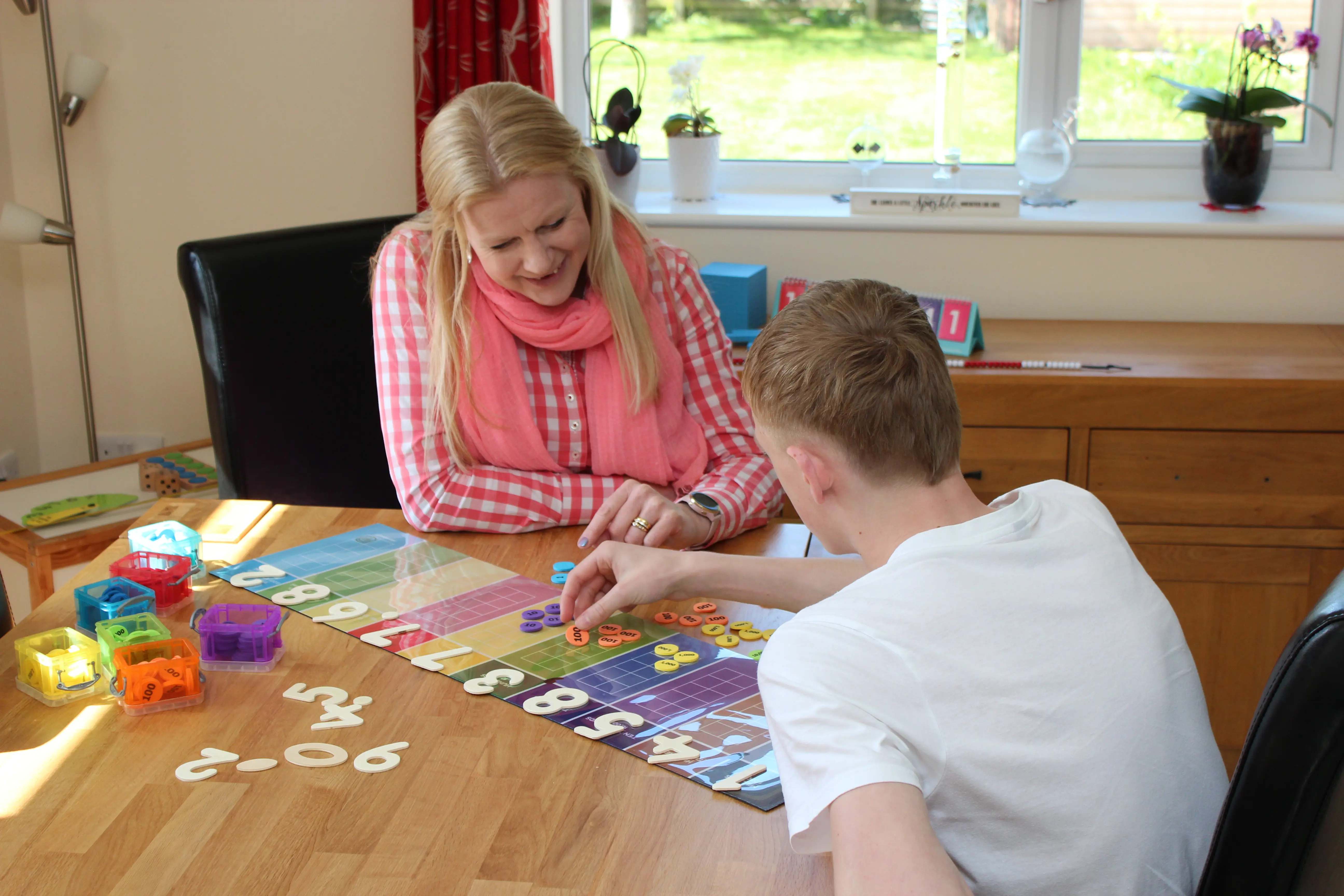 A pupil working with a tutor